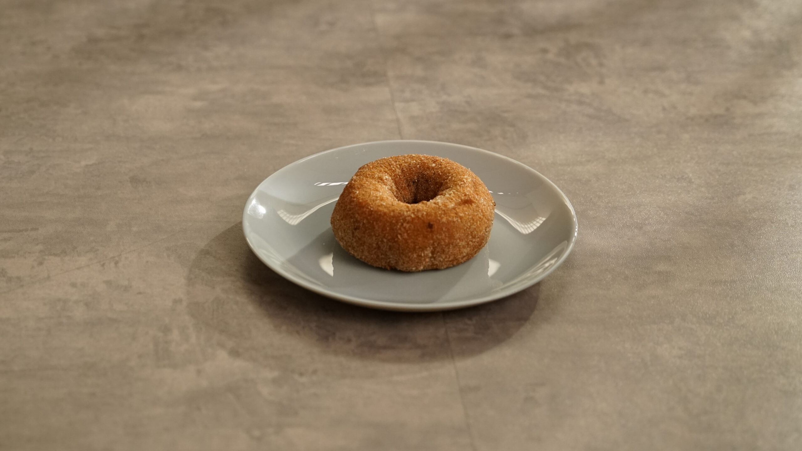 Lifestyle shot of APPLE CIDER CAKE DONUT