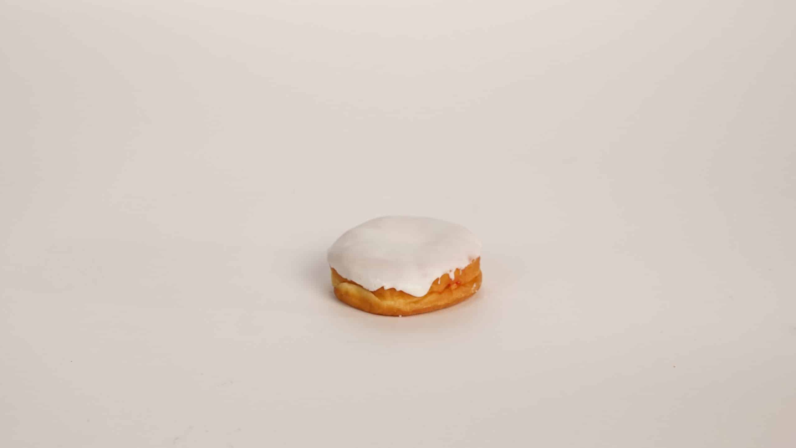 Vanilla Iced Raspberry Filled Yeast Raised Bismarck Single