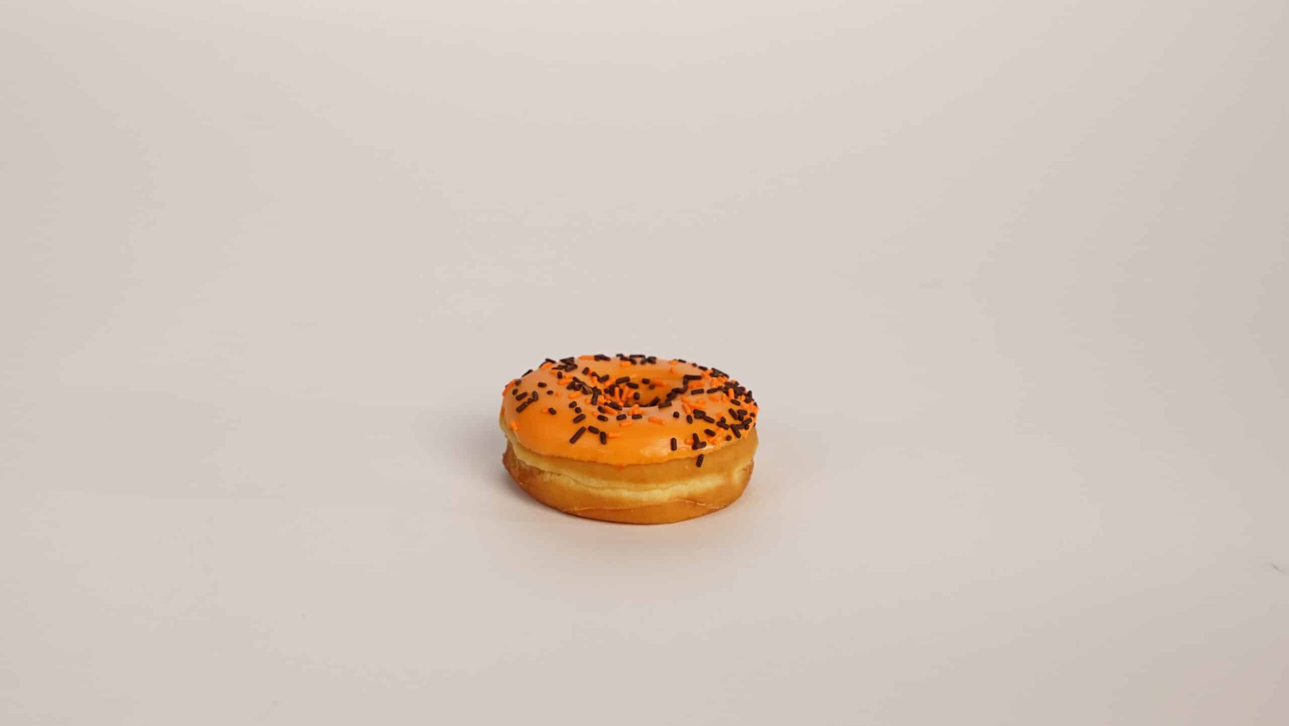Orange Iced Yeast Raised Ring Donut with Decos Single